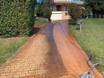 Driveway being pressure cleaned.