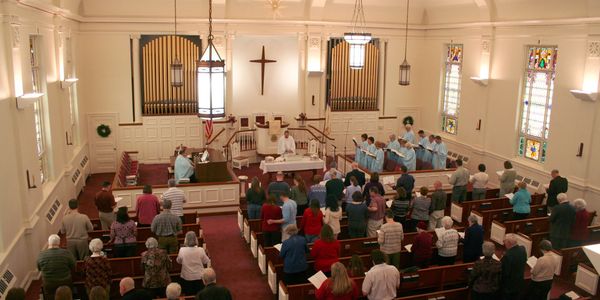 A congregation worships on the first Sunday with their new automated audio system.