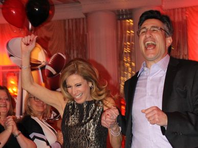 Parents having fun and giving review of Bar/Bat-Mitzvah celebration.