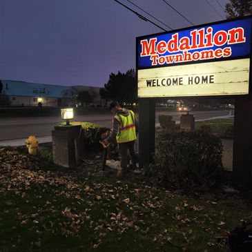 Locating private power to street signs