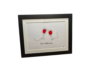 Framed minimalist art of two clinking wine glasses with the phrase "Wine is bottled poetry."