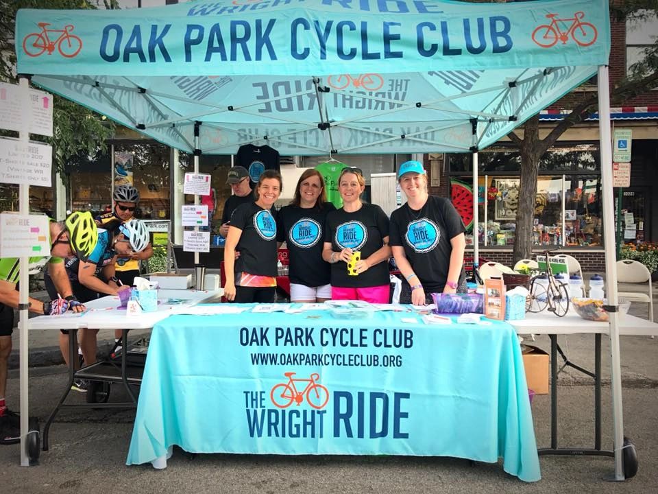 Smiling faces at the Wright Ride registration table.