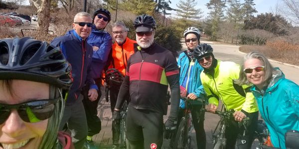 Eight cyclists in winter cycling clothing.