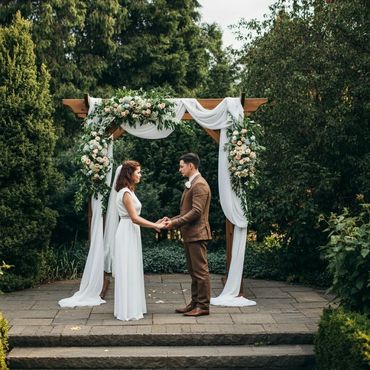 Wooden Arch with Florals and Drapes