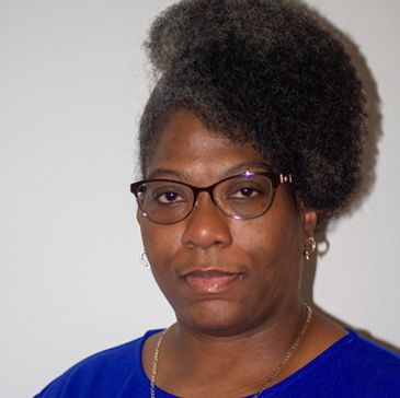 a woman in a blue t shirt and glasses