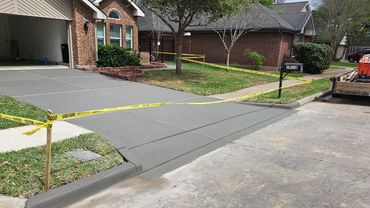Full  driveway replacement in Houston, expertly completed with smooth, flawless concrete.