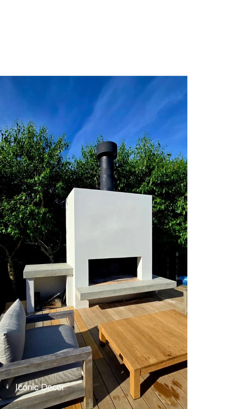 Paint limewash over external render plastered outdoor fireplace.