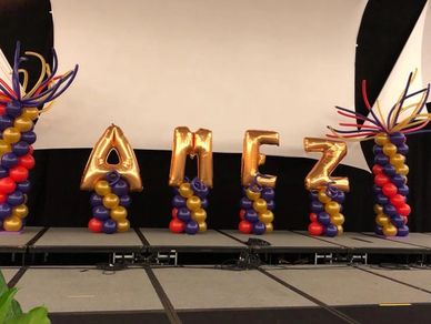 Crazy Hair Balloon Columns and small balloon columns with mylar gold lettering in Birmingham AL.