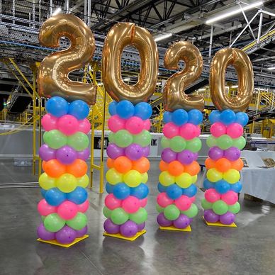 Neon Stacked with Number Toppers for graduation balloon decor.