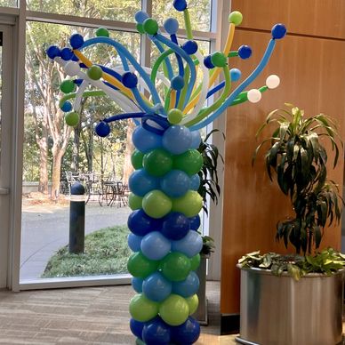 Balloon column with crazy hair for corporate event decor in Birmingham AL.
