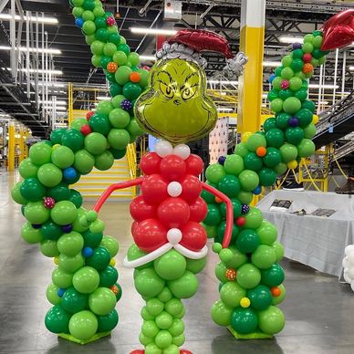 Grinch and Christmas themed balloon decor for corporate holiday event in Birmingham AL