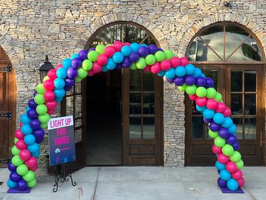 25' spiral balloon arch installation in Birmingham AL for birthday celebration