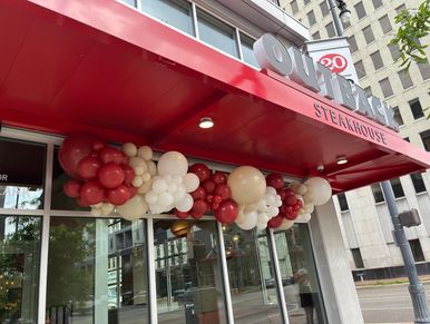 balloon decor over door at grand opening in Birmingham, AL.
