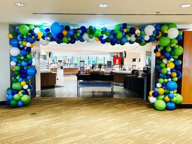 Balloon Arch framing entryway at corporate event in Birmingham AL