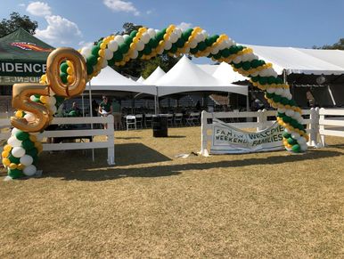 UAB themed balloon arch with mylar number balloon accents at school event in Birmingham AL.