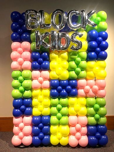 Deluxe balloon wall for photo backdrop with brick design for children's event in Birmingham AL.