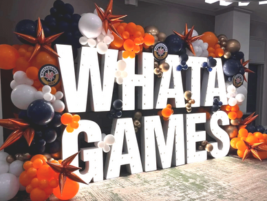 Marquee Lighted Letters with Organic garland and starburst accents for Birmingham AL corporate event