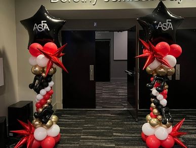 Elegant balloon columns with custom logo star toppers for ASFA school performance in Birmingham AL