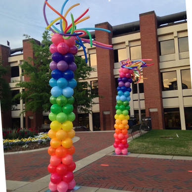 13' crazy hair outdoor balloon columns in rainbow ombre palette for UAB event in Birmingham AL.