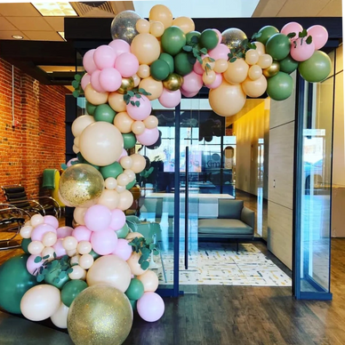 Elegant demi balloon arch over doorway for corporate event in Birmingham AL.