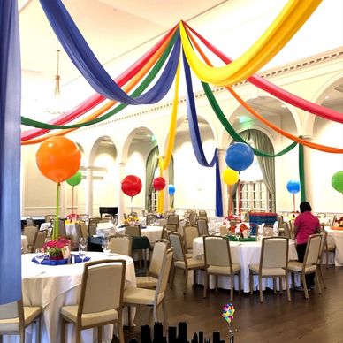 Circus themed party with multi color balloon toppers at Birmingham Country Club in Mountain Brook
