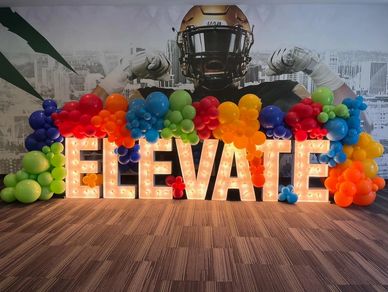 Marquee Lighted Letters with Organic garland and starburst accents for UAB event in Birmingham AL