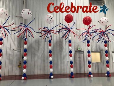 Patriotic red white and blue balloon columns for event at Southerm Museum of Flight.