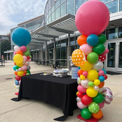 Outdoor candy themed balloon columns at UAB Birmingham AL campus.