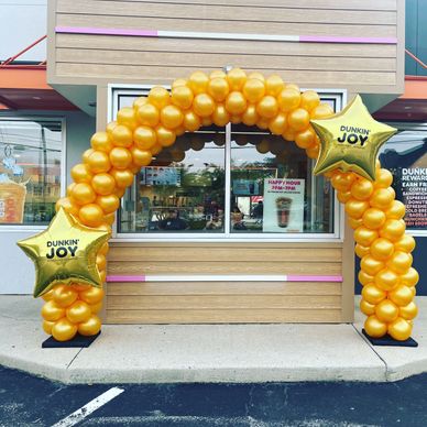 20' solid color balloon arch with custom logo mylar for Dunkin Donuts location in Birmingham AL.