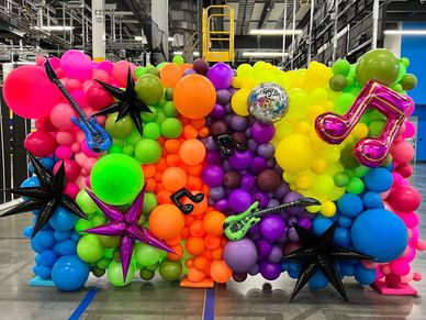 8'x10' balloon wall in neon palette with musical notes for photo backdrop for Birmingham AL event.
