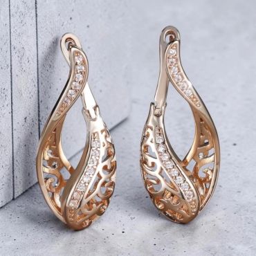 Elegant gold earrings with diamond accents.