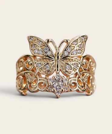 Gold butterfly ring with diamond accents.