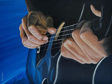 hands playing a guitar