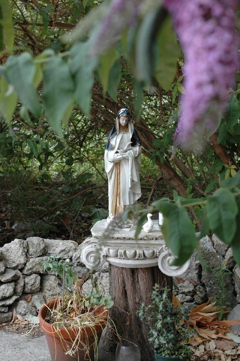 Statue of the Virgin Mary with Geese, one in her arms