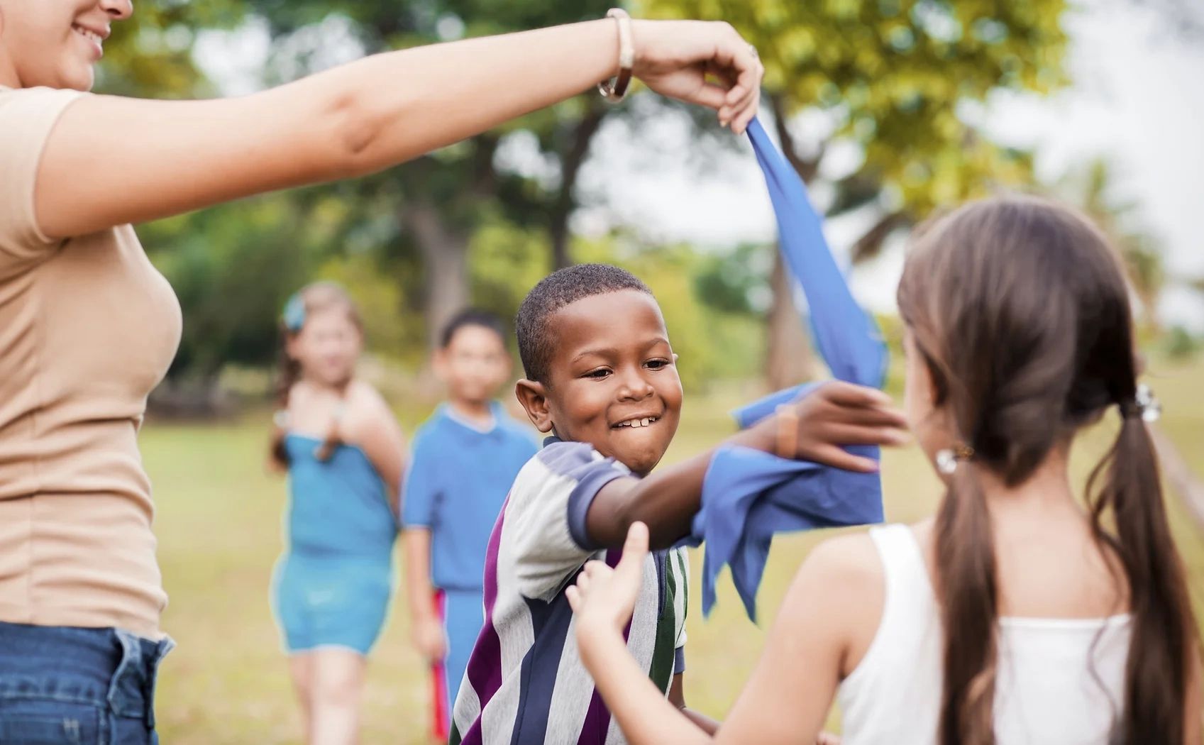 Children play games in a local park.