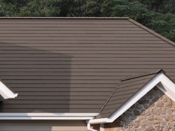 Roof with bronze metal shingles