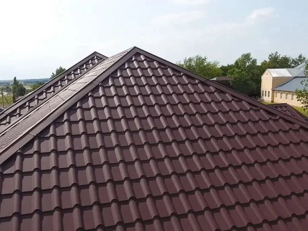 Close-up roof with reddish-brown metal tile