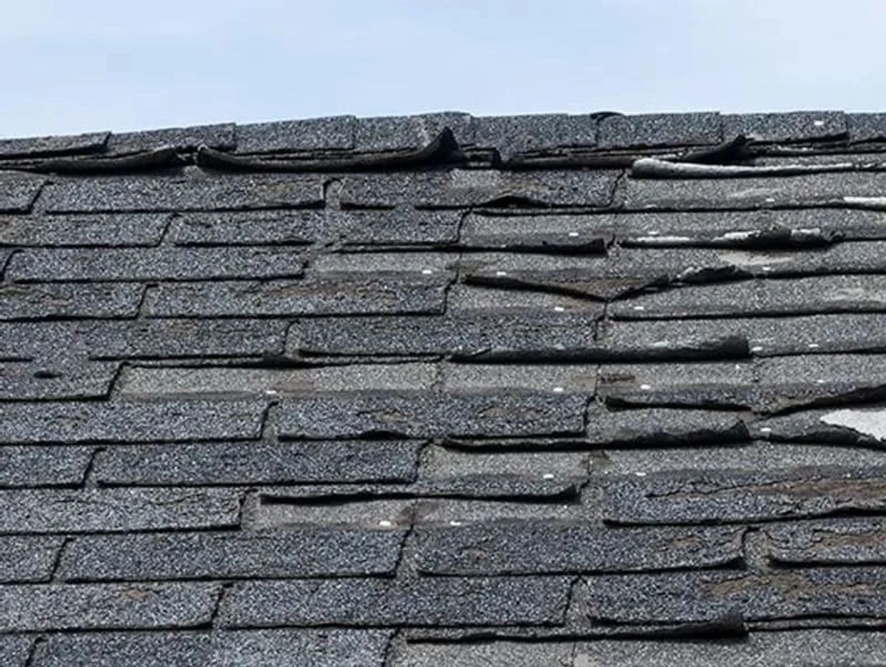 Damaged and lifting shingles