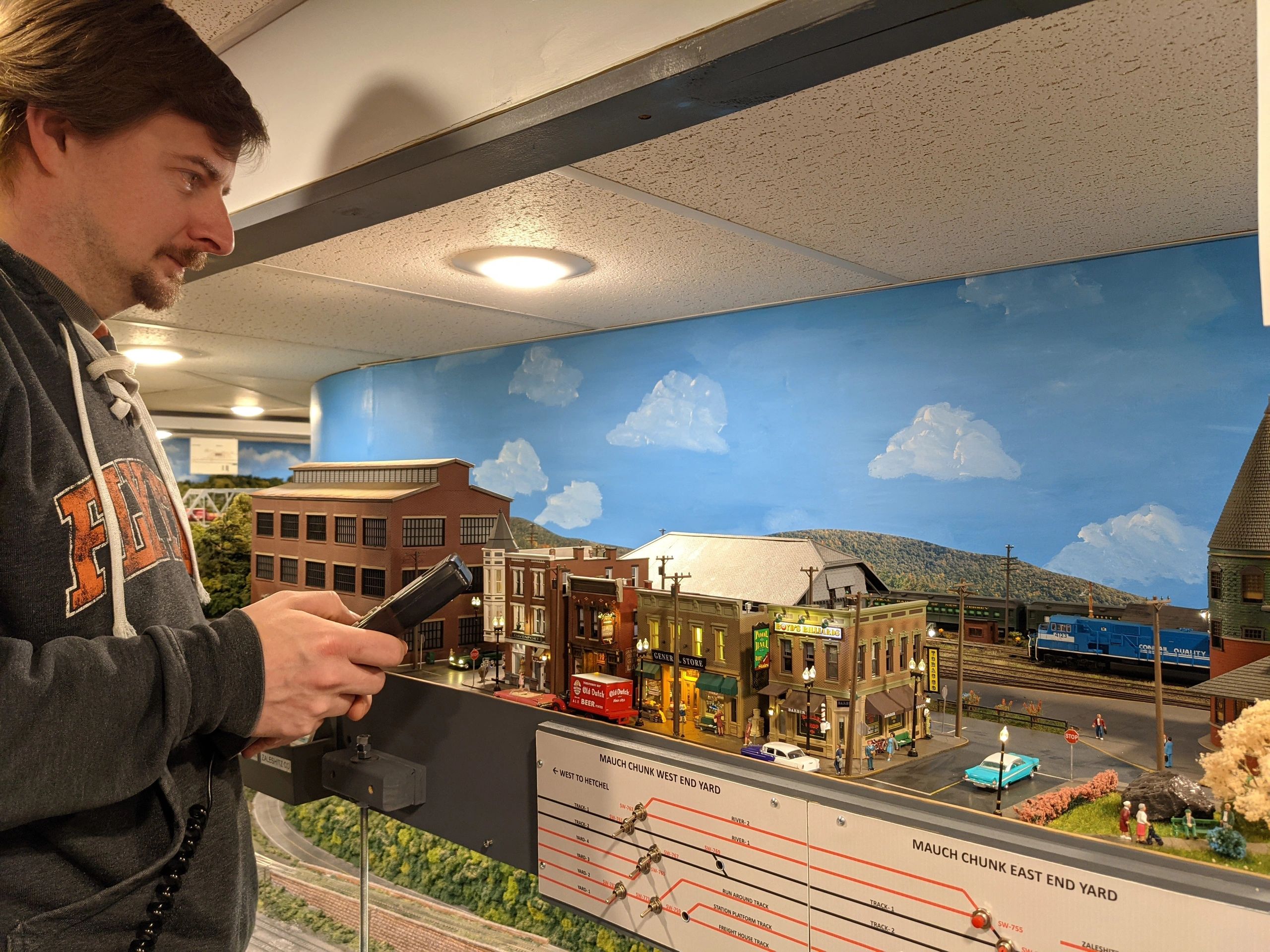 Member operating a train on the layout