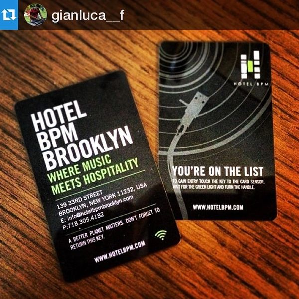 Hotel BPM Brooklyn key cards with music and hospitality theme on wooden surface.