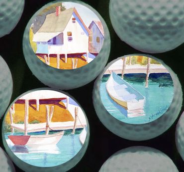 Golf balls with painted scenes of boats and a house on water.