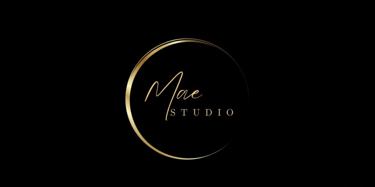 Elegant gold and black logo for Mae Studio with a crescent design.