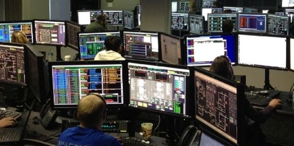 Computer technicians repairing and monitoring computers