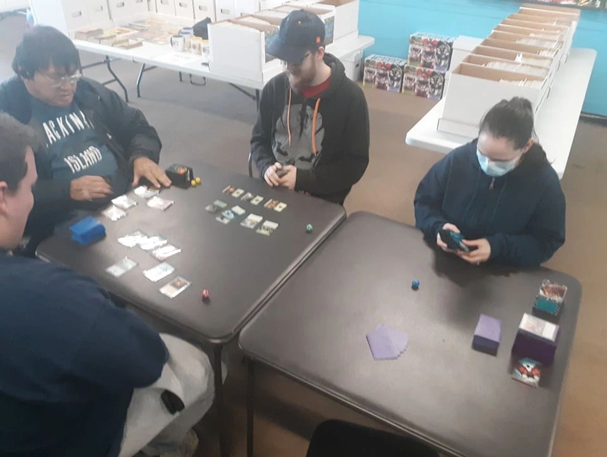 Playing Magic the Gathering in our gaming area.