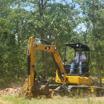 Clearing acreage, road building, boulder removal.