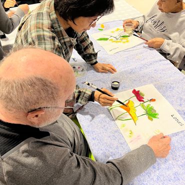 Teaching Korean Brushstroke painting to a PCH program participant.