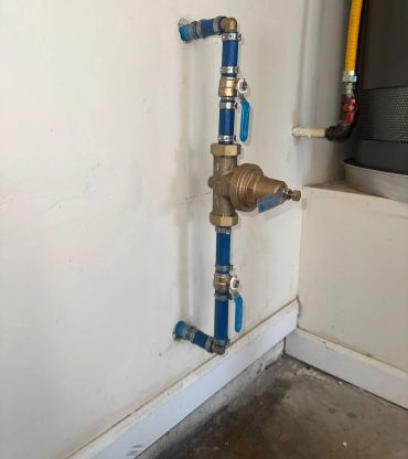 New residential water pressure reducing valve insatlled on a homes main water line.