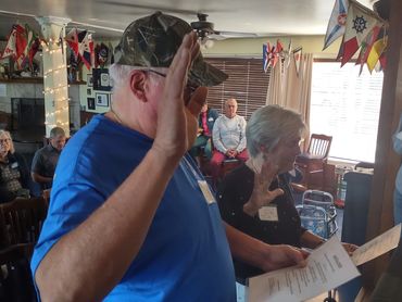 Two people taking an oath indoors.