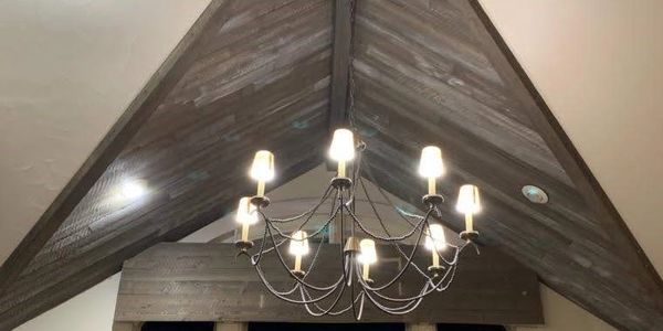 Drapery rod cover panel installation and distressed paint job on ceiling to match cover.
