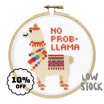 Cross-stitched llama with 'No Prob-llama' text in embroidery hoop.